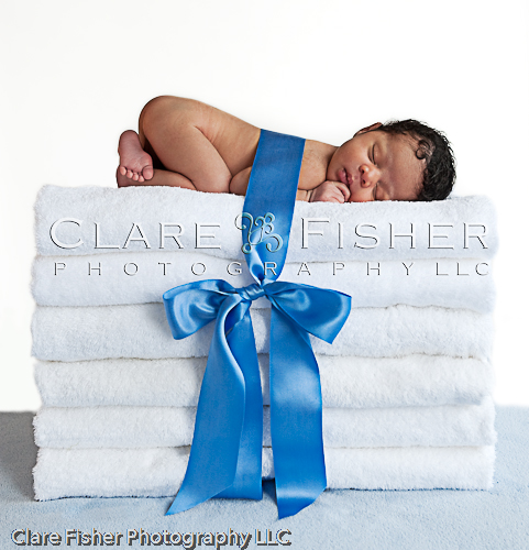 _DSC5903-Edit Newborn on a stack of towels